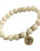 Aumkaara Tranquility Bracelet in gold with White Agate crystal beads Aumkaara Tranquility Bracelet in gold with White Agate crystal beads